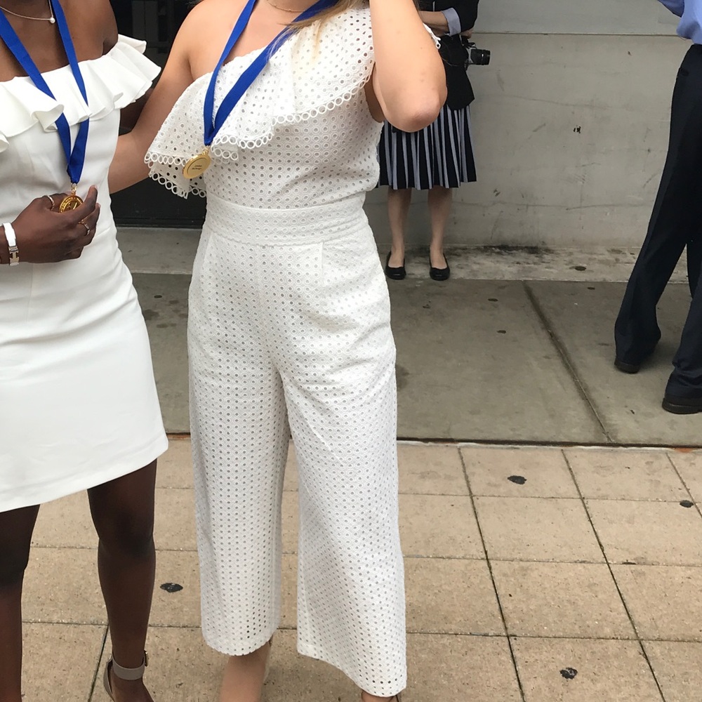 Bloomingdale’s white jumpsuit, one shoulder with lace fabric